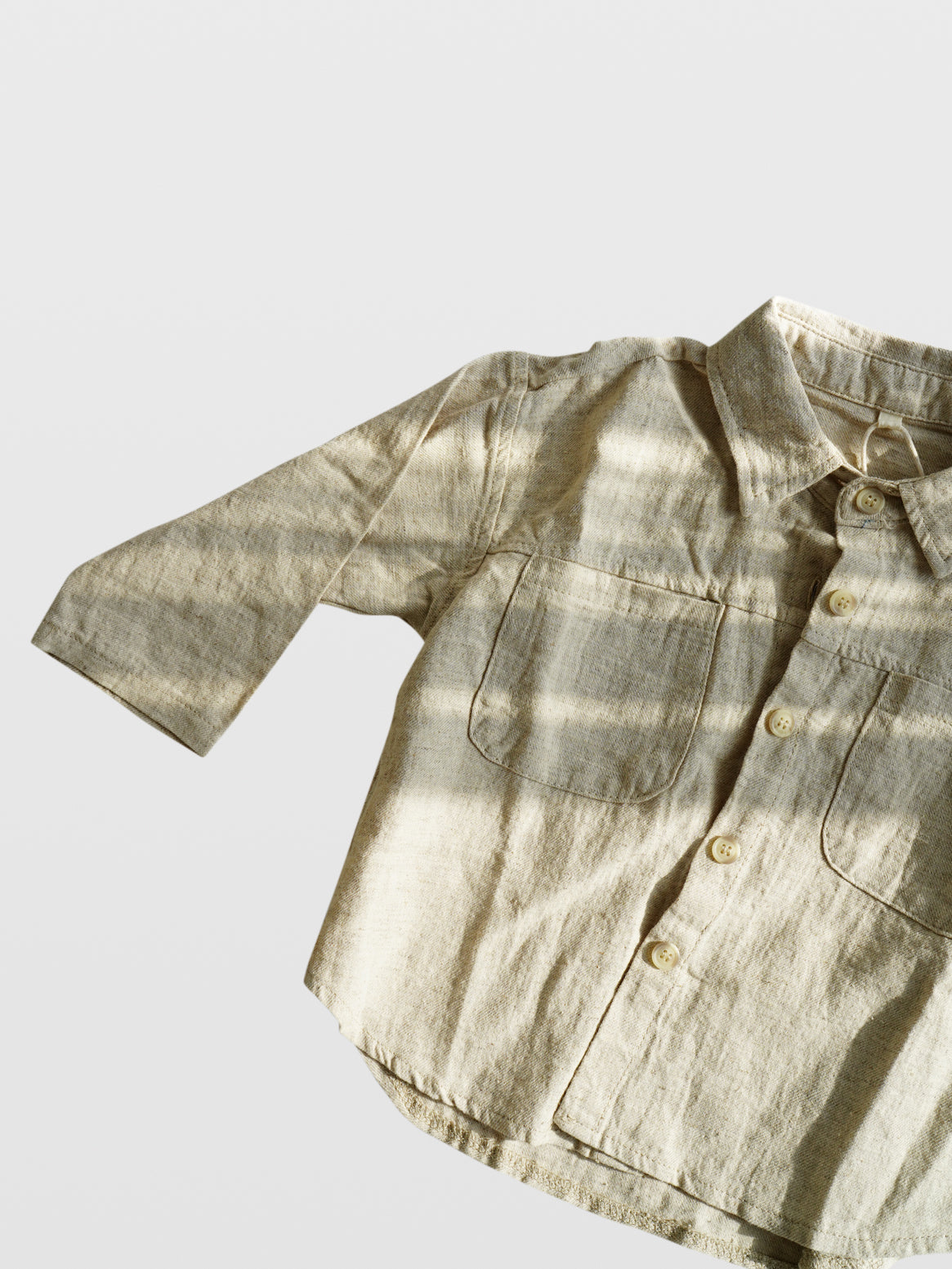 Club Enzo cream and tan linen button up collar shirt with front pockets and button wrists on white background clothes for toddlers boy clothes babies boys girls unisex cool kids mom must haves holiday gift guide trendy kids wear essentials made in Los Angeles toddler jacket kids shopping baby boy boutique baby boy clothes boutique kids shopping children’s boutique online shopping for kids kids wear near me baby clothes near me