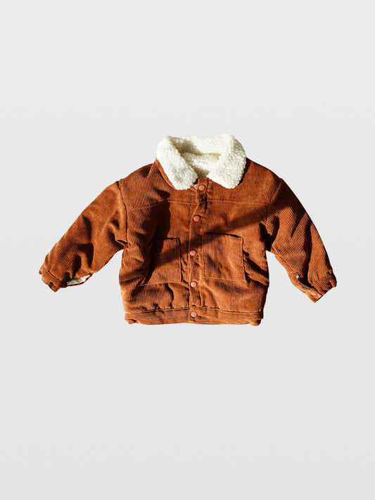 Rust color corduroy long sleeve fall autumn winter jacket coat with rust matte coated snaps double front kangaroo pockets and off white sherpa collar and lining for toddlers babies boys girls unisex cool kids mom must haves holiday gift guide trendy kids wear essentials made in Los Angeles 